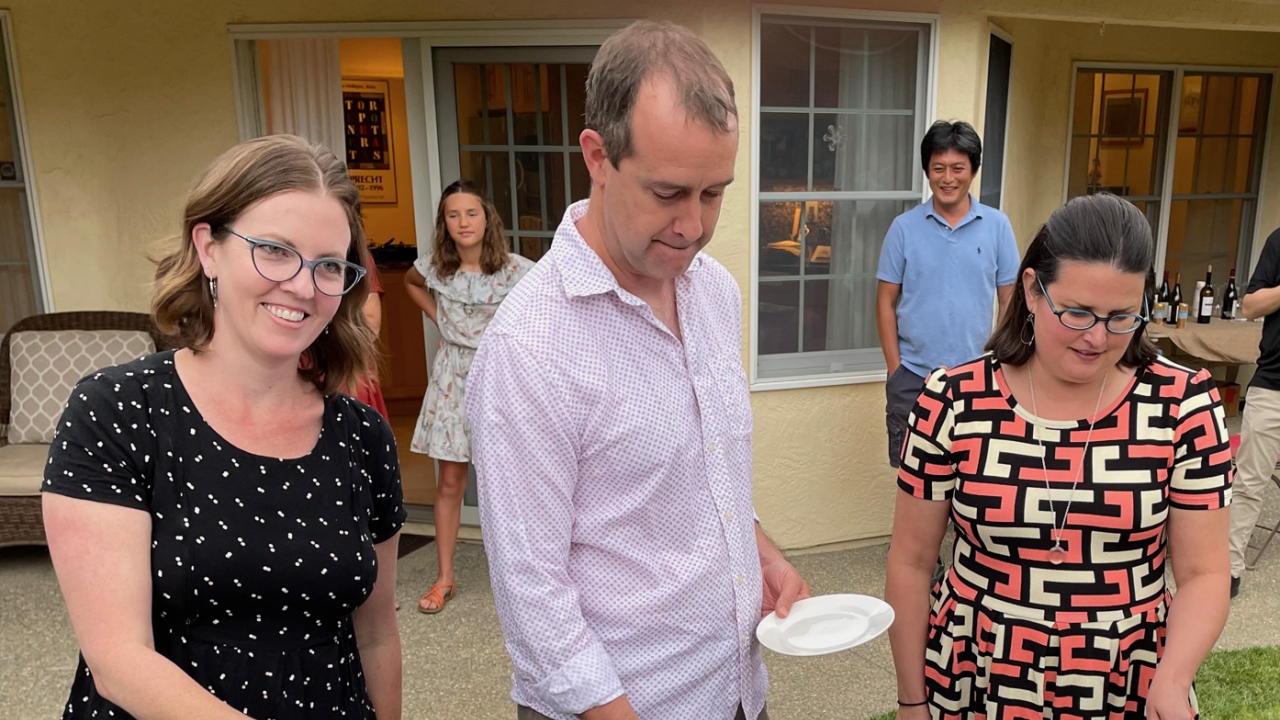 Katherine Ralston, Sean Collins, and Jacqueline Barlow cutting cakes