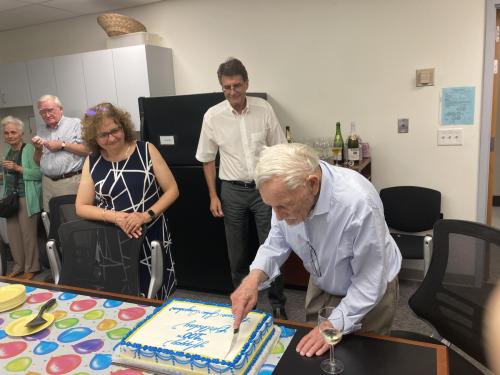 John Ingraham cutting his birthday cake