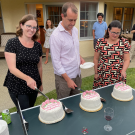Katherine Ralston, Sean Collins, and Jacqueline Barlow cutting cakes